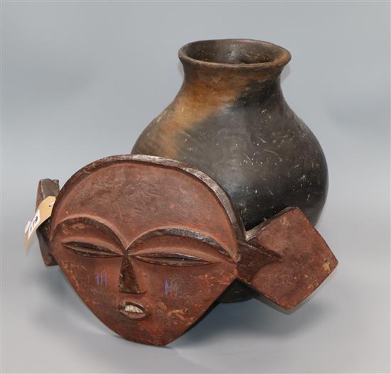 An African Congo Pende Tribe mask together with a pottery vase